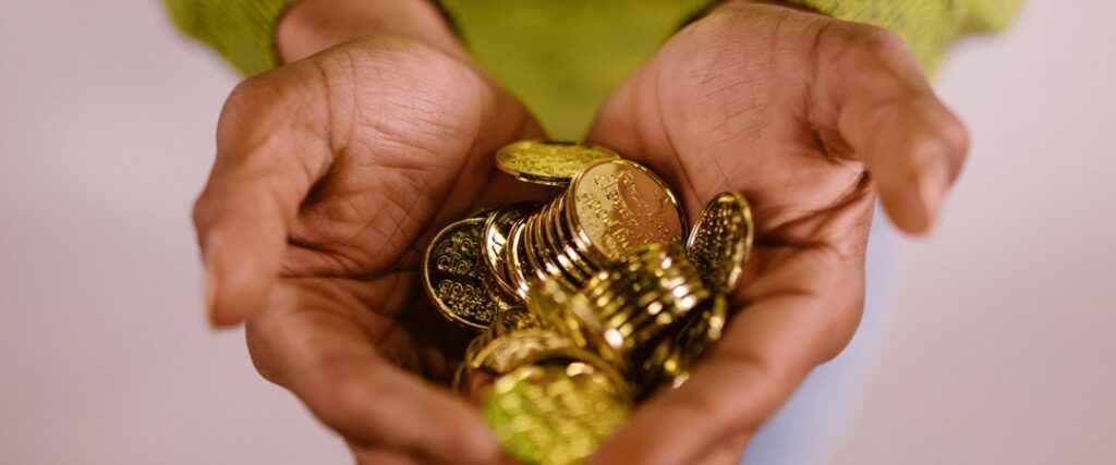 A picture of a person comparing different gold investment options