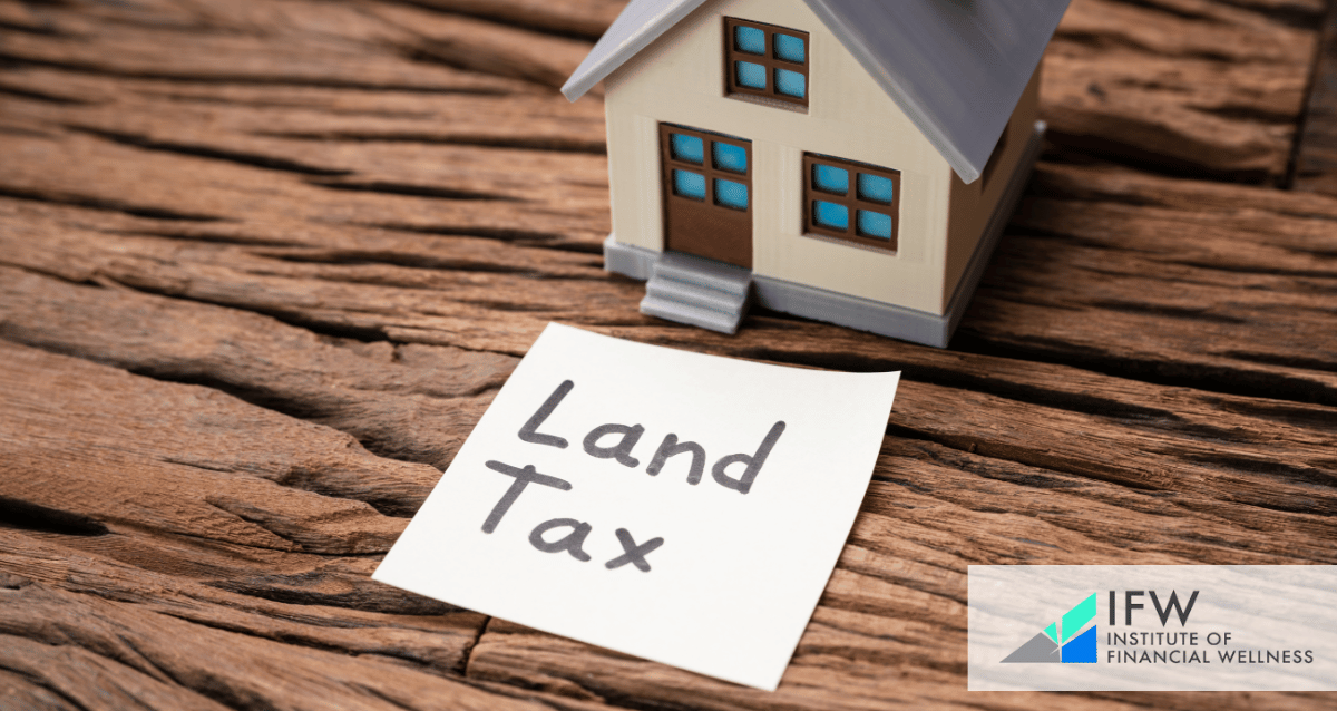 An image with a toy house and a paper that reads "land tax".