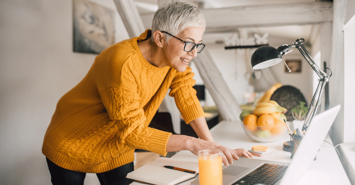 Senior person working on laptop while receiving their social security retirement benefit 