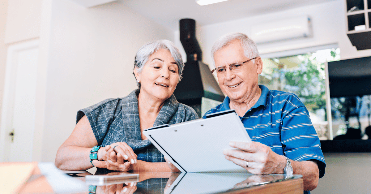 Senior couple discussing retirement planning & their social security benefit.