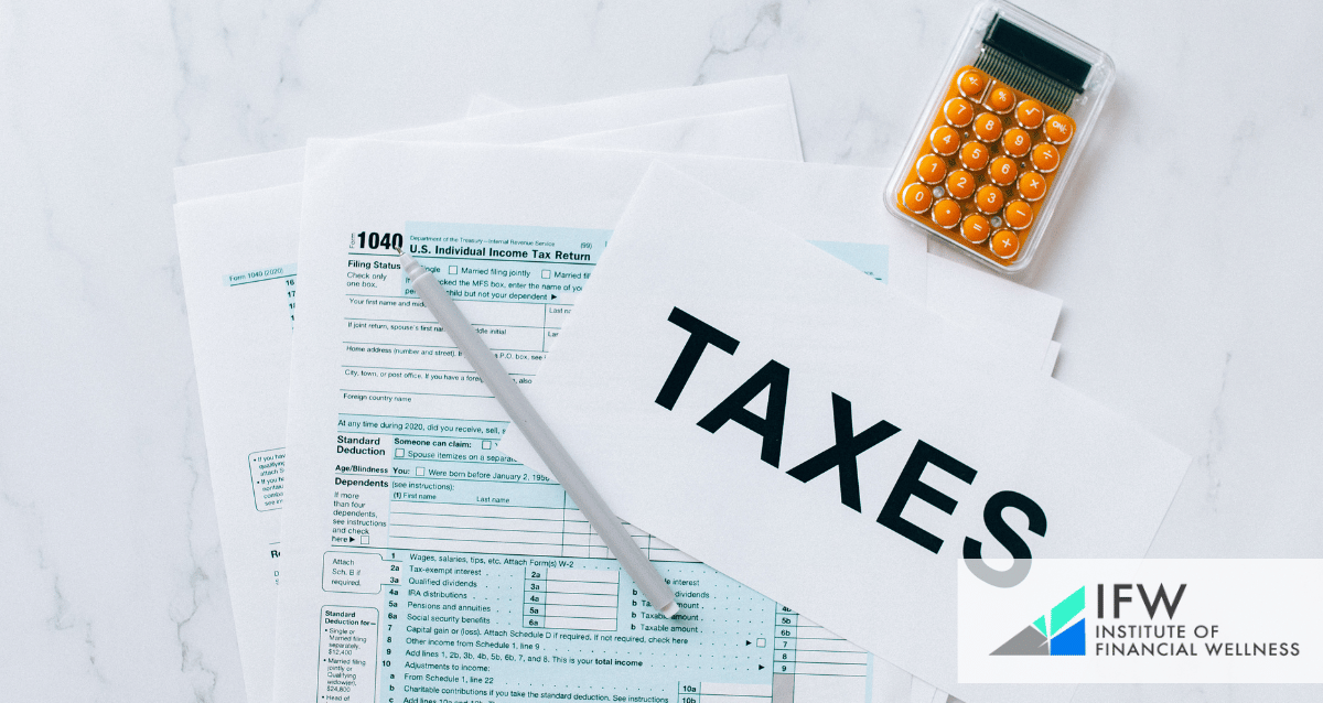 tax forms, a calculator and a paper with the word "taxes"