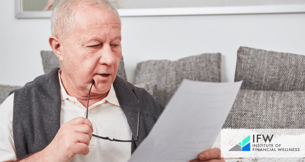 An old man looking at a piece of paper