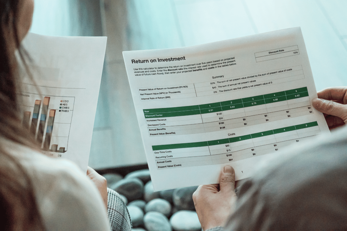 Retirees reviewing their return on investment to manage their portfolio