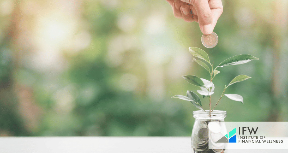 A person inserting coins on a jar