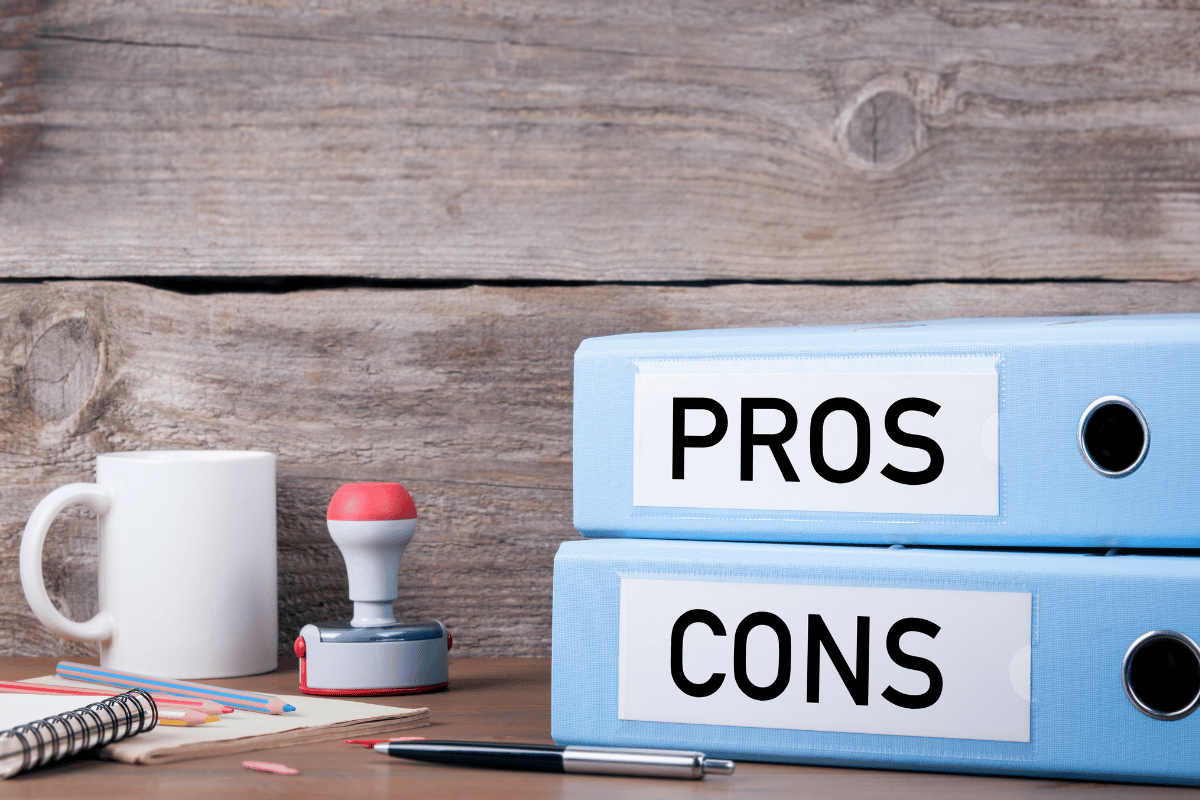 Retirement planning with a financial advisor pros and cons binders on a desk