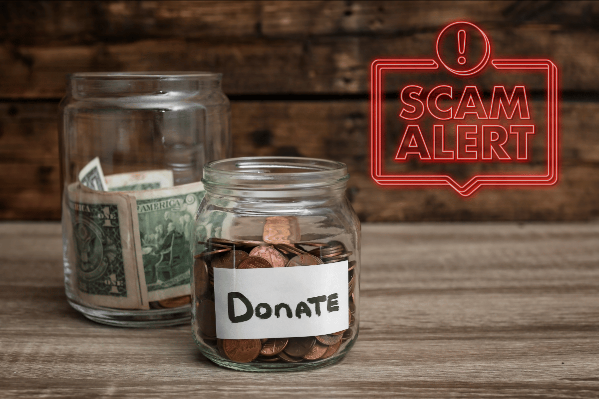 Scam alert superimposed on image of charity donation jars on wooden table