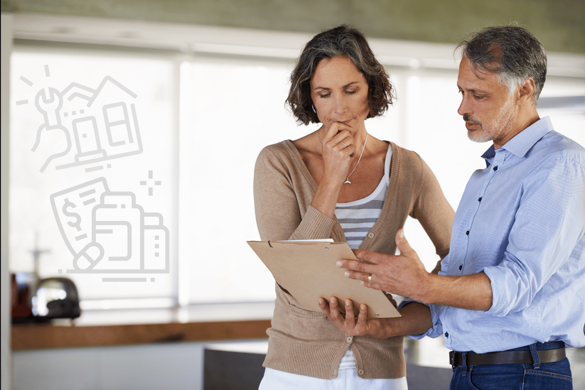 Woman and man assessing unexpected house and medical expenses on a clipboard