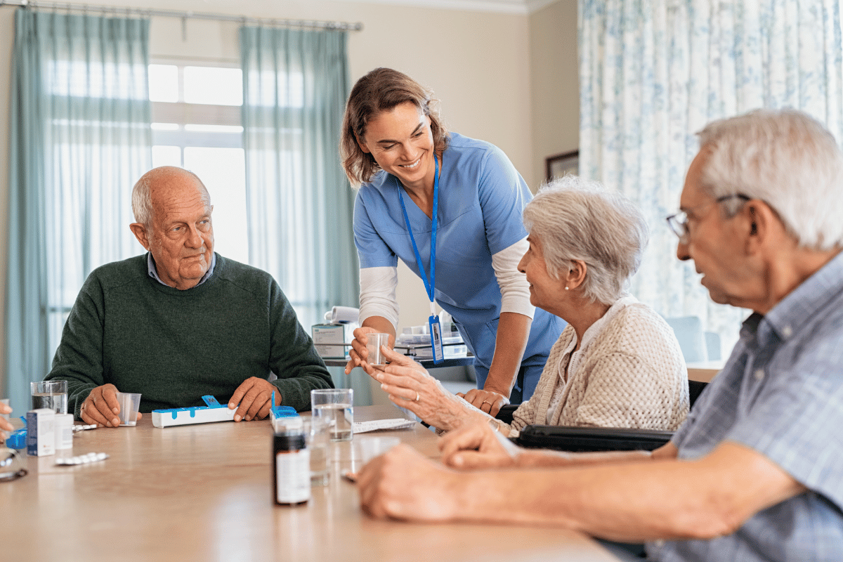 Seniors in long-term care facility with a medical aide