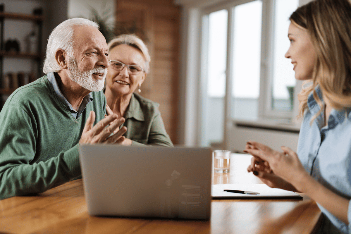 Retirement financial advisor going over services offered for senior couple