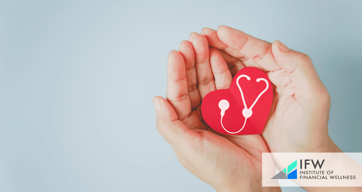 A person holding a paper heart on their hands