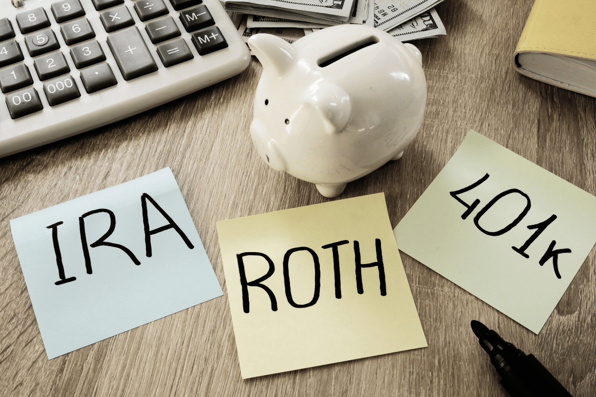 IRA, Roth, and 401k sticky note reminders on a desk