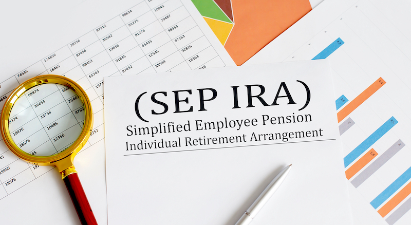 Paper with Simplified Employee Pension Individual Retirement Arrangement SEP IRA on a chart