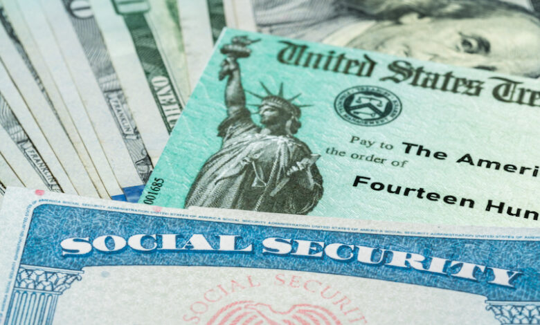 Stack of 100 dollar bills with US Treasury illustrative check to illustrate American Rescue Plan Act of 2021 payment with social security card for retirees