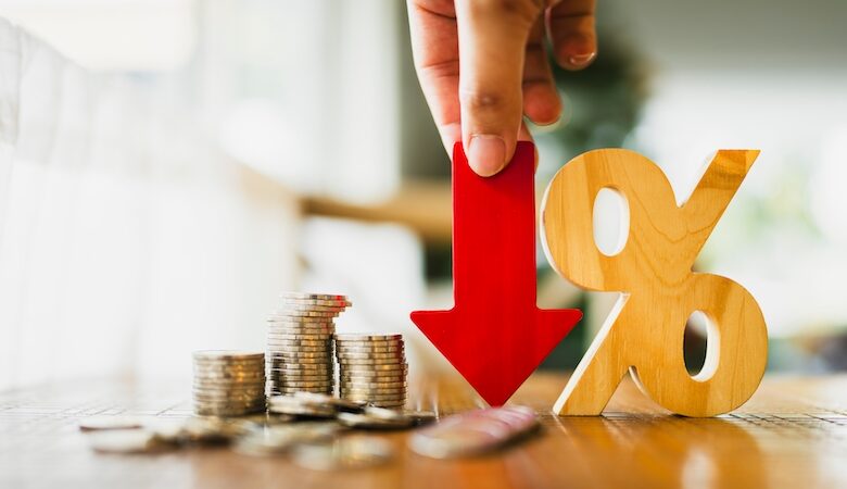 Percentage model, coin stack and down arrow, concepts for success, methods, systems of raising or lowering Fed interest rates to correct inflation concepts.