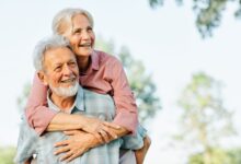 Happy active senior couple having fun outdoors. Portrait of an elderly couple together