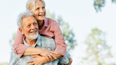 Happy active senior couple having fun outdoors. Portrait of an elderly couple together