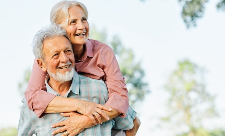 Happy active senior couple having fun outdoors. Portrait of an elderly couple together